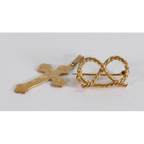 691 - 9ct gold staffordshire knot brooch and 9ct gold cross, 4.6g.