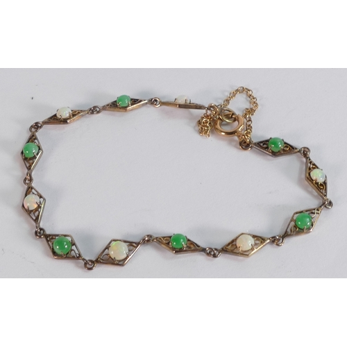 692 - 9ct gold bracelet set with jade and opal stones, 3.9g.