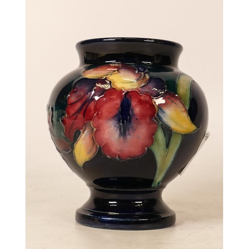 121 - Moorcroft Orchid foot vase. Height 8.5cm. Boxed
Damage to top rim which has been reglued with some l... 