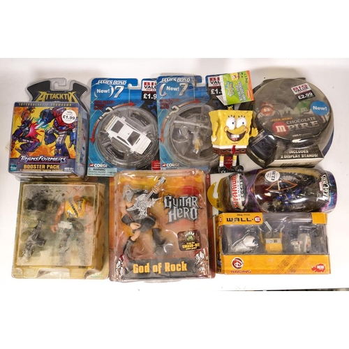 440 - A mixed collection of Carded Figures & Vehicles including Guitar Hero God of Rock, Disney Wall E , M... 