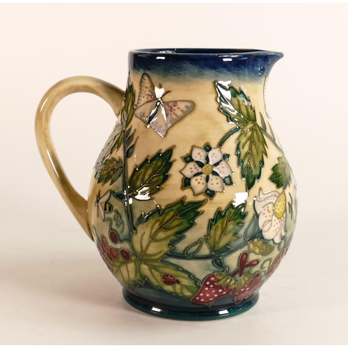 52 - Moorcroft Fruit Garden jug. Height 14.5cm . Silver line seconds quality. Boxed