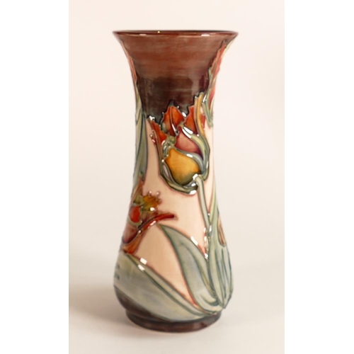 53 - Moorcroft Red Tulips vase together with a matching smaller one. Height of tallest 20cm. Both boxed