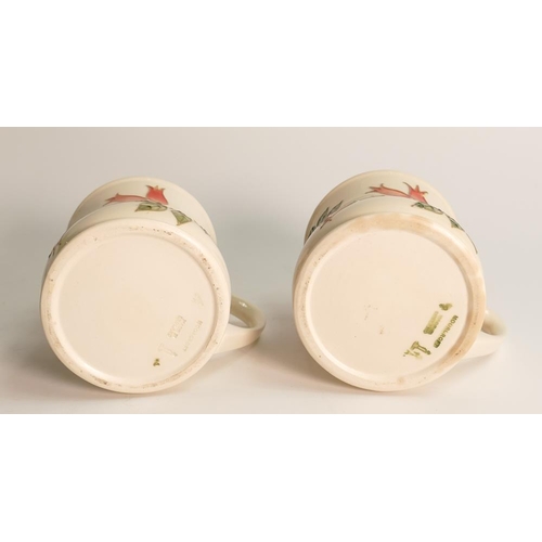 58 - A pair of Moorcroft Rosehip patterned mugs,