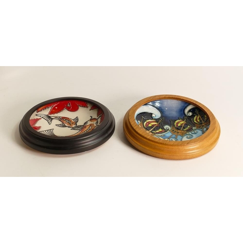 59 - Two Moorcroft framed pin dishes in the Koi carp pattern and the other decorated with pirate boats. D... 