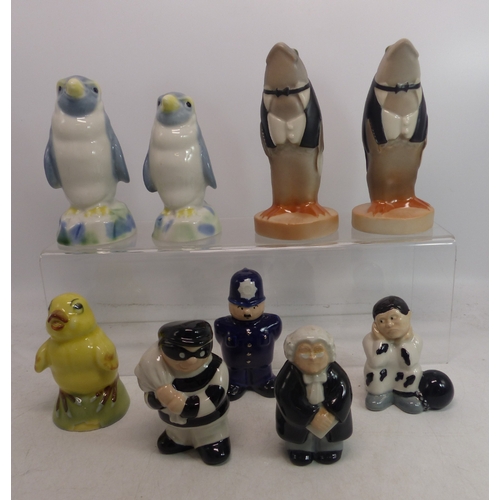 401 - A collection of Wade figures to include Yellow chick with stopper, 2 Penguins, Policeman, Judge, Bur... 