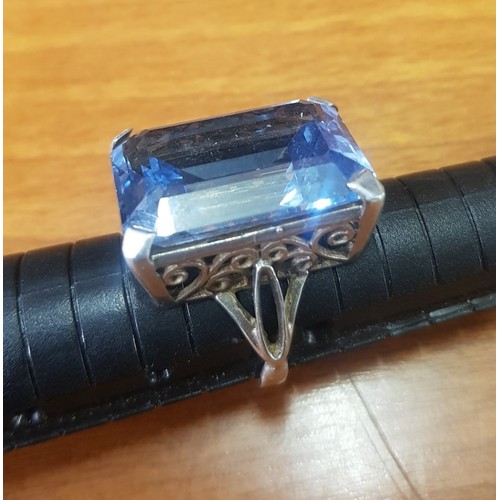 520E - Ornate Silver ring set with large rectangular blue semi-precious stone, overall weight 10.8g (estima... 