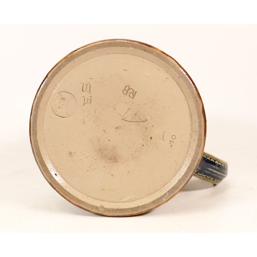 229 - Doulton Lambeth Stoneware Mug. Base is inscribed E.S and RB and 1876. Height: 12cm