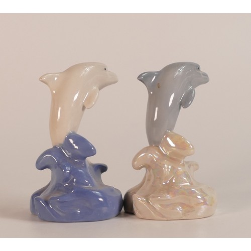 21 - Two Wade Aqualand Dolphins in different colourways, one with a sticker to base stating back stamp ap... 