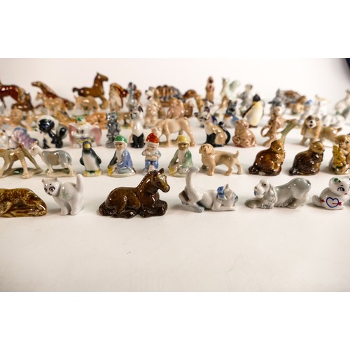 52 - A good collection of Wade Whimsies comprising Disney and first version Whimsies including Merlin as ... 