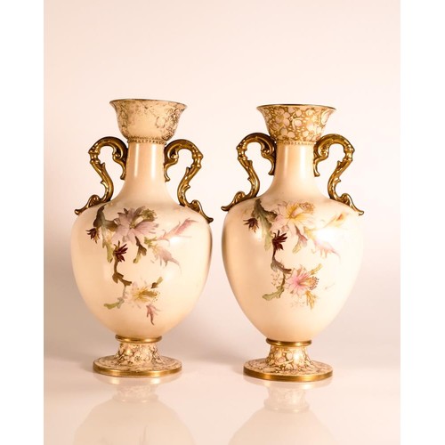 180 - Carlton ware Ivory Blushware twin handled Baluster vases in the Christmas Cactus pattern. Gilt decor... 