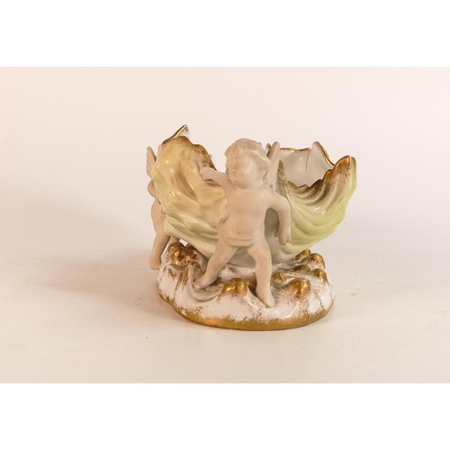 189 - Carlton ware Wiltshaw & Robinson Ivory centre vase in the form of two putti supporting a large faded... 