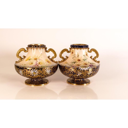 192 - Carlton ware Wiltshaw & Robinson Ivory Blushware twin handled squat vases in the Daisy pattern. Flow... 