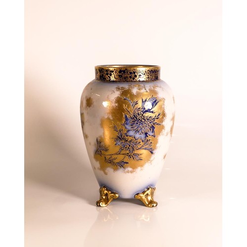 197 - Carlton ware Wiltshaw & Robinson three footed vase in a Flow blue floral design with raised gilt bor... 