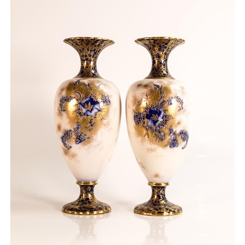 198 - A pair of Carlton ware Wiltshaw & Robinson Baluster vases in the Petunia pattern, flow blue with rai... 