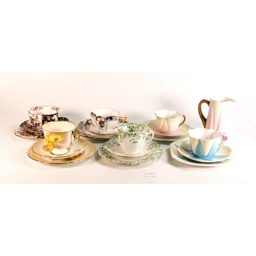 817 - A collection of Shelley trios to include 11993 floral handled Dainty shaped, Wileman 5106 Lily shape... 