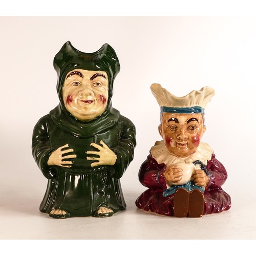 855 - Wileman & Co Intarsio character jugs of a monk & baby. 21cm high (2)