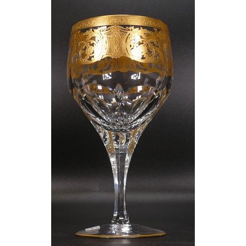 903 - Seven De Lamerie Fine Bone China heavily gilded Robert Adam pattern water goblet / wine glasses, in ... 