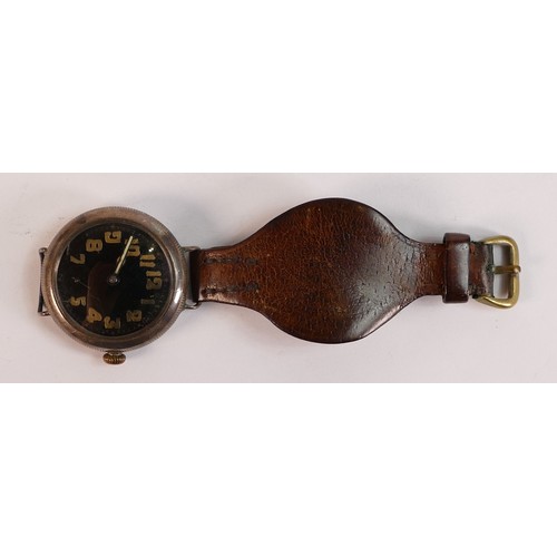 2068 - World War I WWI trench watch, black dial, the case appears to be silver but back too tight to remove... 