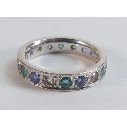 2209 - 18ct hallmarked white gold full eternity gemstone set ring size R.  Set sapphires, emeralds & others... 