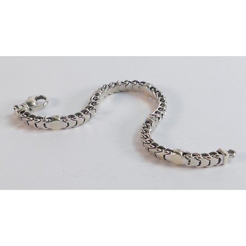 2213 - 9ct hallmarked white gold & diamond bracelet, 19cm wearable length.  Weight 25.8g.