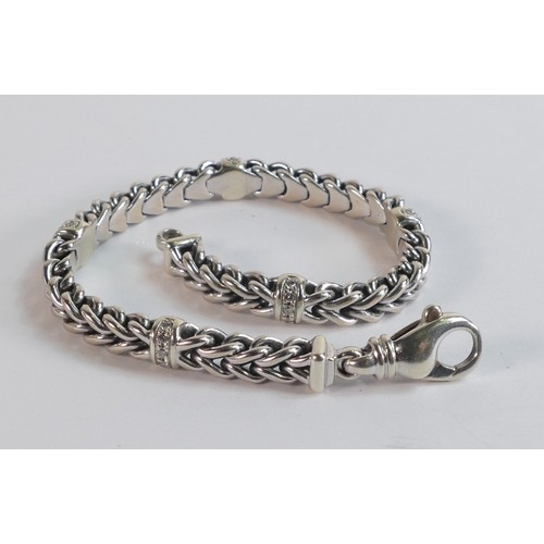 2213 - 9ct hallmarked white gold & diamond bracelet, 19cm wearable length.  Weight 25.8g.