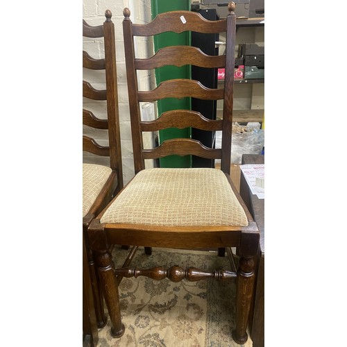 599 - A set of 5 Oak ladder back upholstered dining chairs with one carver (5)