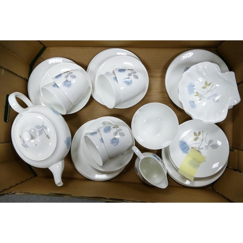 53 - A large collection of Wedgwood Ice Rose Patterned Tea & Dinnerware including two Handled cups & sauc... 