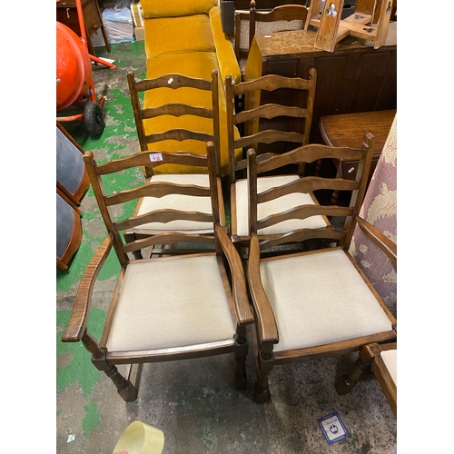 616 - Set of 6 upholstered ladder-back dining chairs (4 +2 carvers).