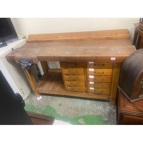 628 - Large mid century oak work bench, with bench vice and integral drawers.