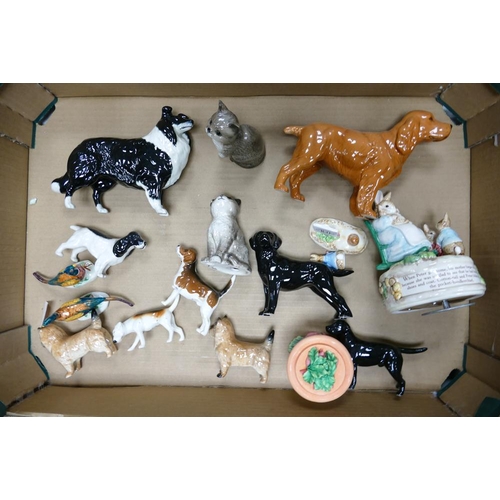 15 - A collection of Beswick animals to include Collie, King Charles Spaniel, Labrador , cats, terriers e... 