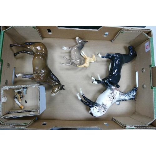 59 - A collection of damaged Beswick horses including Black Gloss Hackney , 2nd Version Appaloosa etc