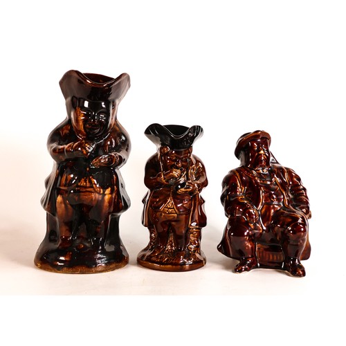 40 - Three Rockingham style treacle glazed character jugs, tallest 23.5cm - two at fault. (3)