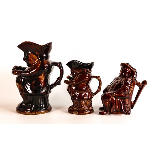 40 - Three Rockingham style treacle glazed character jugs, tallest 23.5cm - two at fault. (3)