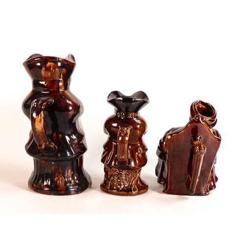 40 - Three Rockingham style treacle glazed character jugs, tallest 23.5cm - two at fault. (3)