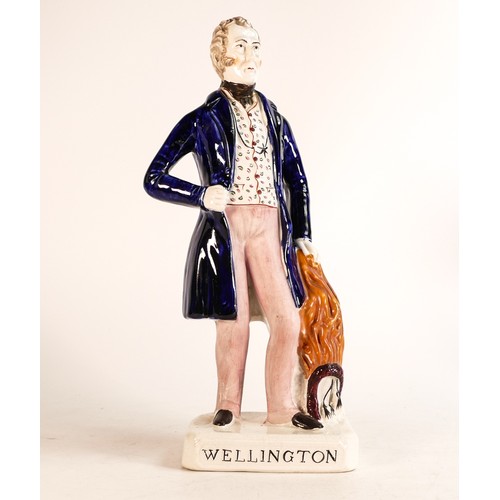 46 - Mid-Victorian Staffordshire figure depicting Arthur Wellesley, The Duke of Wellington. Firing crack ... 