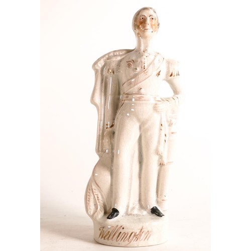 50 - Mid-Victorian Staffordshire figure of Wellington modelled in dress uniform. Decorated in White and g... 