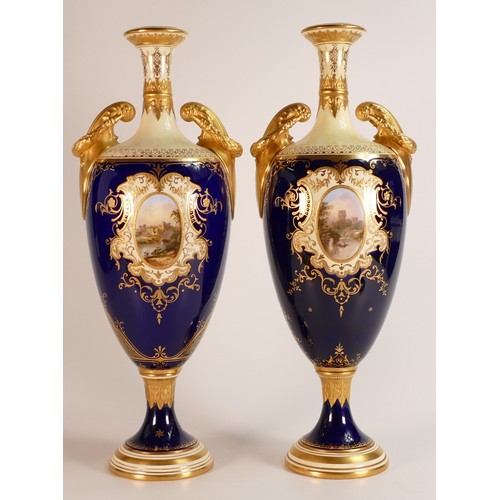 52 - 19th century Coalport pair of two handled vases, gilded all over & decorated with panels of Windsor ... 