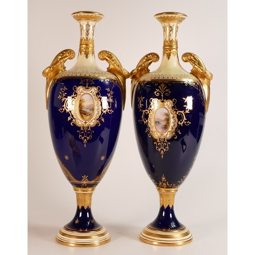 52 - 19th century Coalport pair of two handled vases, gilded all over & decorated with panels of Windsor ... 