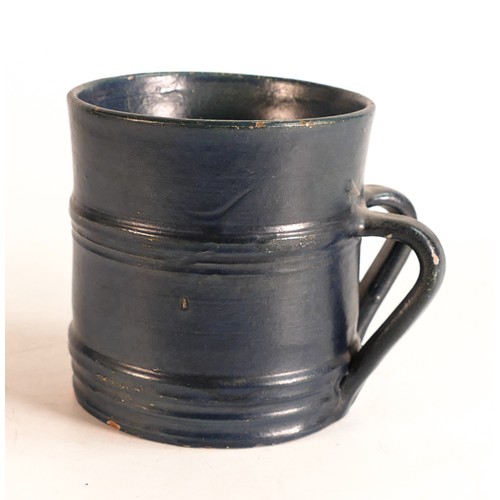 66 - Dicker Ware Sussex two handed tankard, in deep blue mat glaze, hairline to rim & various paint chips... 