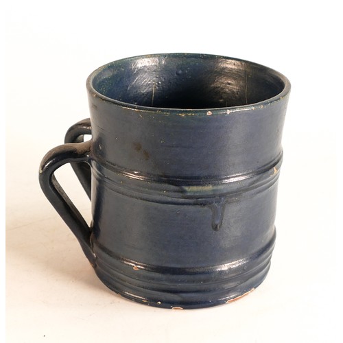 66 - Dicker Ware Sussex two handed tankard, in deep blue mat glaze, hairline to rim & various paint chips... 