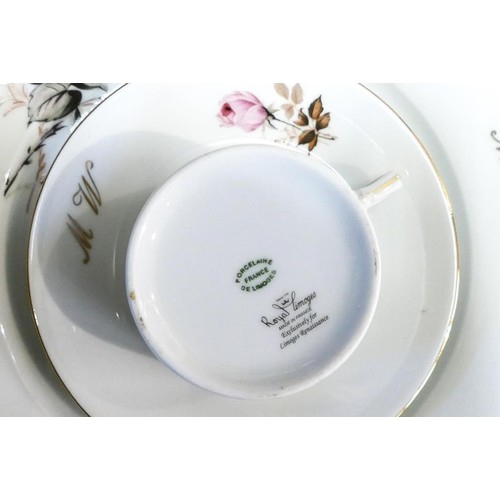 403 - Royal Limogues pink rose dinner ware with the initials M W to include - 12 dinner plates, lidded tur... 