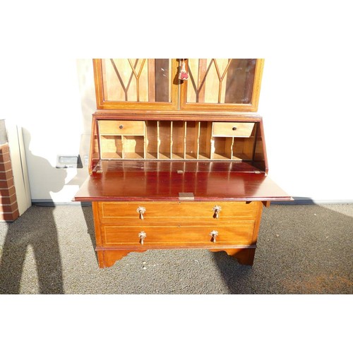 305 - 19th century Secretaire bookcase. Marquetry inlay to desk front, geometric marquetry banding to draw... 