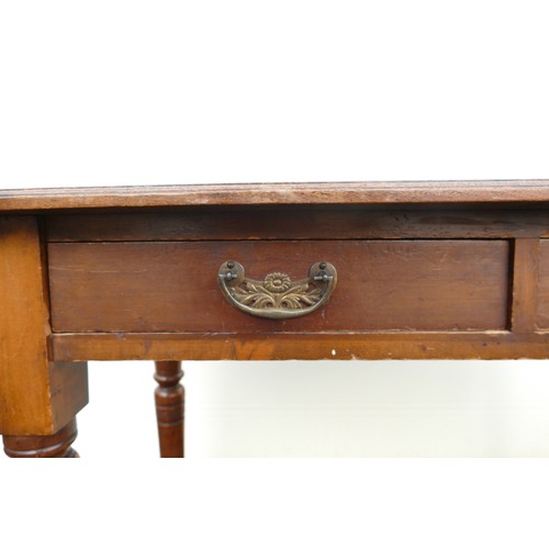 316 - Victorian leather topped writing desk on turned supports. Inset black leather top. Two drawers to fr... 