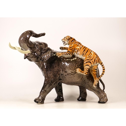 299 - Beswick Elephant and Tiger 1720. Restoration to tails, trunk and both tusks.