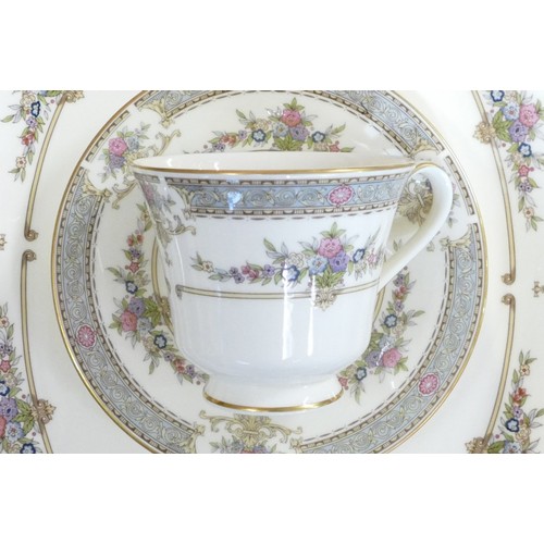 124 - A collection of Minton Persian Rose tea and dinnerware, including tea set, large platters, tureen & ... 