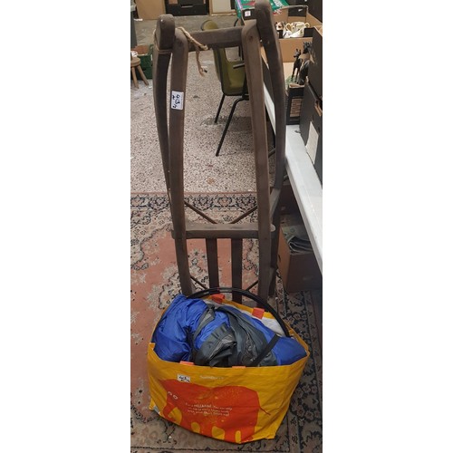 413 - A vintage wooden sledge together with a 2 man Oxford branded tent, with other camping accessories pl... 