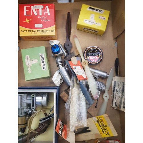 412 - A collection of model airplane engines, propellers and accessories