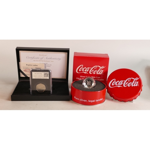 747 - UK 2018 50p date stamp proof coin and a Coca Cola silver coin, boxed. (2)