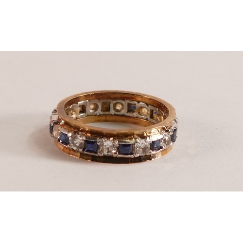 749 - 9ct gold eternity ring set with blue and white stones, size M/N, 3.9g.