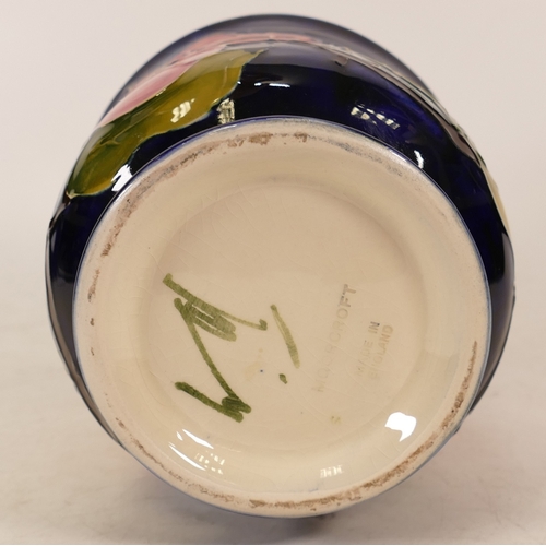 116 - Moorcroft Magnolia planter on blue . Height 13cm, diameter 13.5cm